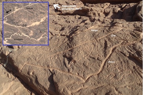 Figure 4 Engravings on the sandstone rock of Aozu (photo by the author). Inset: Satellite imagery of the greater Aozu area. Source: Google maps, modified by the author.